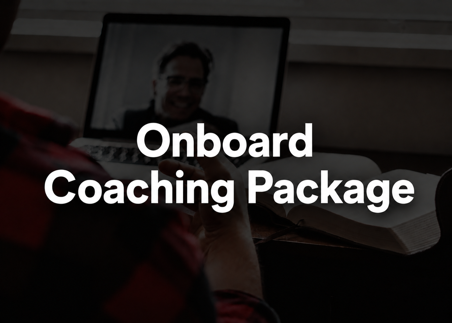 A dark promotional graphic with large white text reading 'Onboard Coaching Package' over a dim scene showing a person at a desk with an open laptop and notebook.