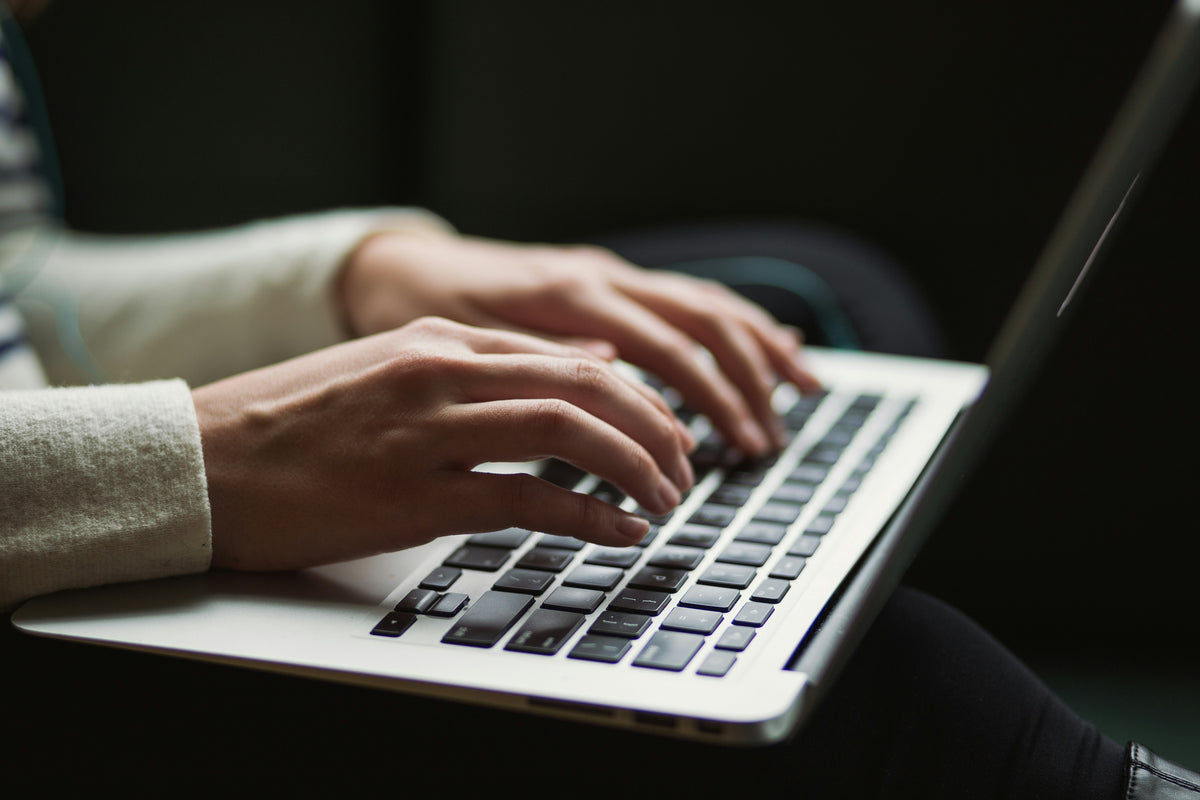 Woman working typing on laptop 